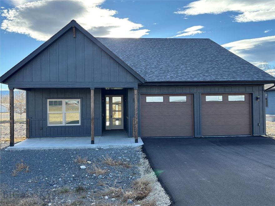 Welcome to this beautifully designed new build offering modern comfort, refined finishes, and thoughtful craftsmanship throughout. This single-level home features an impressive open-concept layout, starting with a grand entryway that sets the tone for the rest of the property.
The spacious living, dining, and kitchen areas flow seamlessly together, highlighted by vaulted ceilings, elegant lighting, and a striking kitchen complete with custom cabinetry, a large island, and eye-catching countertops. Natural light pours through generous windows, enhancing the warm and inviting atmosphere.
The master suite is a true retreat, featuring a stunning spa-inspired bathroom with a freestanding soaking tub, an oversized tiled shower with glass enclosure, dual vanities, and a large walk-in closet.
Two additional bedrooms and a full guest bath offer comfort and flexibility for family, guests, or office space.
Enjoy the convenience of an oversized two-car garage with ample room for vehicles, storage, tools, or recreational gear—perfect for Montana living.
Situated on a generous 14,723 sq ft lot, this property offers space, style, and the opportunity to make both home and yard truly your own.