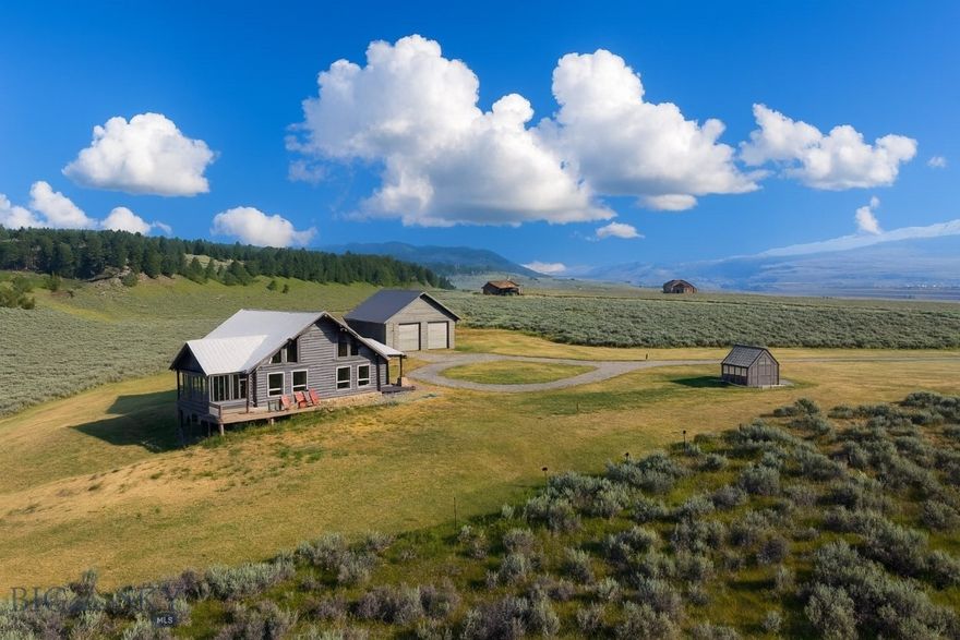 Custom Log Home in Madison River Ranches – 75 Madison Trail, Cameron, MT
Offered at $893,500
This log home in Madison River Ranches combines quality craftsmanship with the kind of setting people come to Montana for. The 3,039 SF home includes 3 bedrooms, 2 baths, and a spacious loft that works well for extra living or sleeping space.
The main living area is open and filled with natural light from large picture windows that frame the Madison Range and Continental Divide. A wrap of wood interiors gives the home a warm, practical feel that suits the landscape. Outside, the covered deck extends the living space and takes in wide, unobstructed views and the sunroom is perfect for when the weather is not.
A 1,225 SF insulated and heated garage/shop offers plenty of room for vehicles, boats, and gear. Owners in Madison River Ranches also share a 55-acre common area with private access to the Madison River, one of the West’s most famous fisheries.
The location puts you close to Cliff, Wade, Earthquake, and Hebgen Lakes, making it easy to fish, boat, hike, or explore Yellowstone, which is less than an hour away.  The property has fiberoptic internet connection, 1000 gallon underground propane tank, and 30 gallon per minute well!
If you’re looking for a log home with both comfort and direct access to Montana’s best recreation, this one is worth a look.
