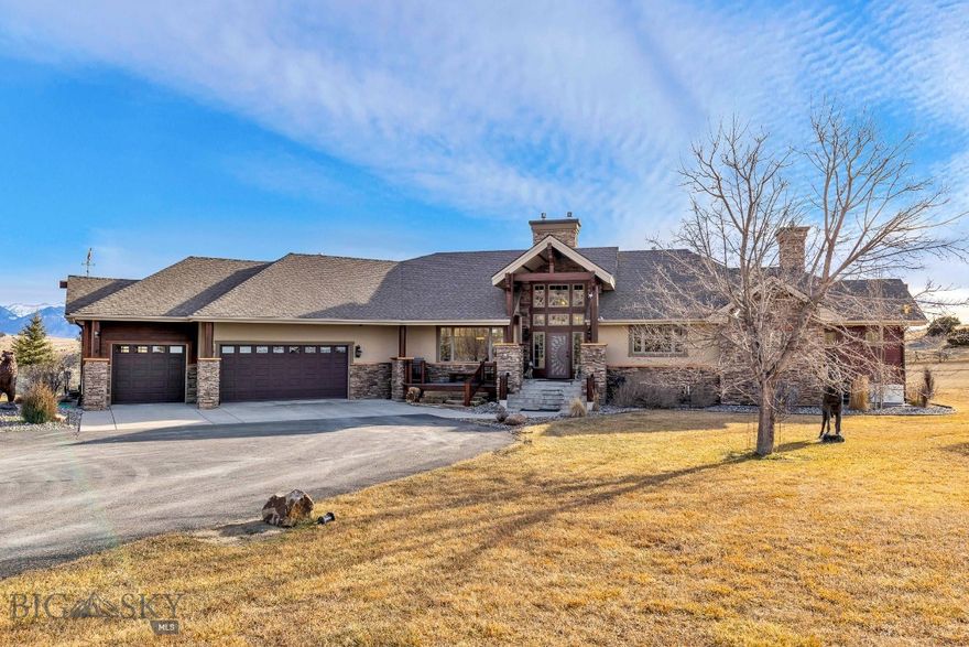 This exceptional custom Montana luxury residence is a blend of timeless craftsmanship,
thoughtful design, and elevated living. Set on 20.2 acres of unobstructed views, the home is
perfectly positioned on one of the premier lots within the subdivision, offering privacy, space,
and sweeping vistas in every direction.
The interior showcases rich natural materials throughout, including copper trim, warm wood
and log accents, and a dramatic stacked stone fireplace that serves as the focal point of the
living room. A pine tongue-and-groove ceiling enhances the authentic character,
creating an inviting atmosphere. The kitchen is anchored by beautifully crafted
alder and hickory cabinetry, granite countertops, and a beautifully designed custom stone cooking area that blends functionality with striking visual appeal. Pella wood-clad tinted windows frame the surrounding landscape
while offering energy efficiency and year-round comfort, bringing the beauty of Montana
indoors.
Outdoor living is a true highlight, featuring an impressive three-tier deck ideal for hosting
gatherings, or simply taking in the uninterrupted views.
Beautifully designed landscaping enhances the setting, blending naturally with the surrounding
terrain and adding to the home’s curb appeal.
The lower-level family room extends the home’s entertainment options, featuring a wet bar and
direct access to a deck with creating an ideal space for gatherings, recreation, or relaxed evenings with friends and family. The primary suite offers a private sanctuary with a spa-like bath, private fireplace, access to a
private deck while additional bedrooms and living areas provide
flexibility for guests, work, or recreation—all finished to the same uncompromising standard.
The property is further complemented by a spacious heated three-car garage, offering ample
room for vehicles, storage, and recreational gear—perfectly suited for Montana living.
Beyond the home, residents enjoy access to over 1,600 acres of common area easements,
providing extensive hiking and riding trails, East Gallatin River access, and a fully equipped
equestrian center designed for both horse and rider. These exceptional amenities elevate the
lifestyle and make this community truly unique.
A rare opportunity to own a truly custom Montana luxury home where craftsmanship, acreage,
mountain views, and premier community amenities come together seamlessly—this property defines Montana living at its finest.