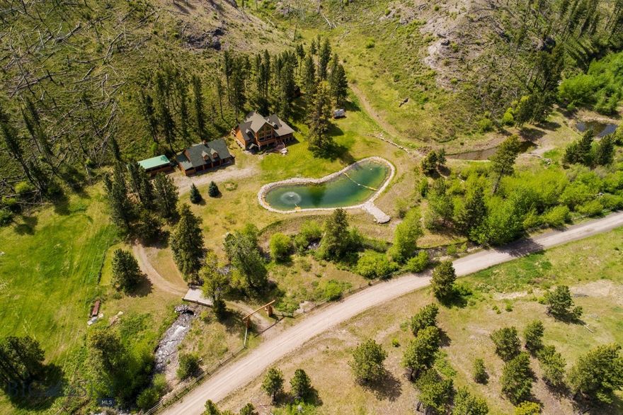 Set beneath the Beartooth Mountains and the Absaroka Range just a few miles east of Gallatin National Forest and in the West Bridger Creek drainage, this exquisite mountain sanctuary features a custom 4,696± square foot home and guest quarters on 39± deeded acres. About 750 feet of both sides of West Bridger Creek cascades by the home, just 35± minutes from Big Timber, Montana. The easily manageable acreage includes a diverse array of mature timber and mountain meadows and a beautiful pond outside the home’s large picture windows, providing habitat and water for big game, birds, small mammals, and other wildlife.