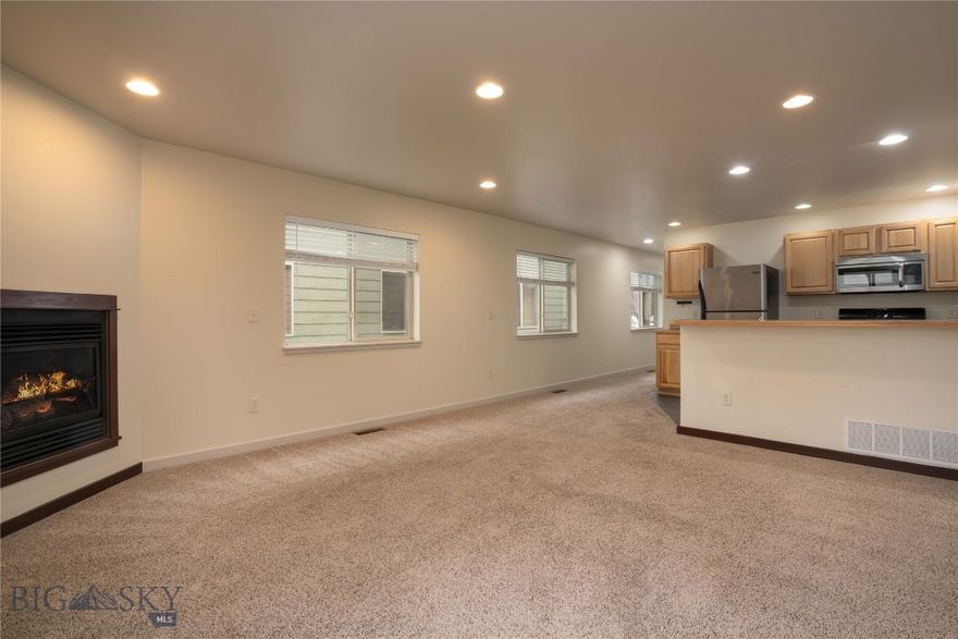 Incredible value and spacious living await at this end-unit, westside Bozeman condo. This property features a functional floor plan with a main floor great room and bedrooms on 2nd level. The fully amenitized kitchen features tile flooring, a dining bar, stainless appliances, gas range, wood cabinetry and an upgraded dishwasher. The living/dining area features a gas fireplace and access to the sunny back patio. A convenient half bath is accessed off the tile entry area – with additional convenient storage. The one-car garage features additional storage shelving. Upstairs is the primary suite that features views to the Bridger Mountains, ensuite bath and walk in closet. Two additional spacious bedrooms share a hall bathroom. The laundry is accessed off the upstairs hallway – washer and dryer convey. Window coverings throughout. According to the professional condo HOA management, this complex allows for fencing the backyard and HOA fees include water and sewer, plowing of the shared driveway area and landscaping maintenance – buyer to verify. Enjoy neighborhood parks and trails – and the convenience of being only minutes to shopping, restaurants, schools, parks, medical services and amenities. Just minutes to Montana State University. 15 minutes to historic downtown Bozeman, 30 minutes to Bridger Bowl, 1 hour to Big Sky Resort, 30 minutes to blue ribbon fly-fishing. Don’t miss the virtual 360 Matterport tour!