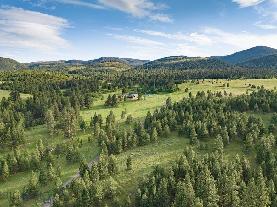 Perched on an elevated ridge overlooking the Nevada Creek Valley sits Mile High Ranch, a four-season recreational retreat in the midst of some of Montana’s wildest landscapes. The ranch offers privacy and room to explore, yet, at just under 170 acres, it is manageable with all the amenities those looking for a rural escape could want. The property is ideally improved with a 4,456+/- square foot, remodeled two-bedroom log home with two additional rooms which could be converted into bedrooms as well as an unfinished basement allowing for supplemental living or storage space.  Additional improvements include a fully appointed guest cabin, heated shop, equipment shed, and garden space with greenhouse. The property is gated, fully perimeter fenced, and adjoins state ground, which in turn provides access to the 11,380-acre Hoodoo Mountain Wilderness Study Area.