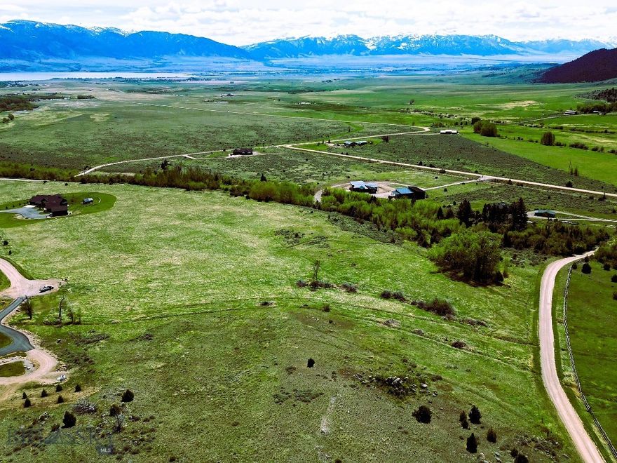 Final opportunity in the highly sought-after Stone Ridge Views Subdivision, this exceptional ±10-acre parcel stands out as one of the finest lots in the community. Offering unobstructed, panoramic views of the Madison Valley, Madison Range, Ennis Lake, and the Tobacco Root Mountains, this property delivers a truly breathtaking Montana backdrop in every direction.

South Meadow Creek runs adjacent to the property, enhancing the sense of tranquility and natural beauty. The thoughtfully repositioned building site is perfectly placed to maximize sweeping vistas while maintaining privacy and serenity. Power and fiber optic are available at the lot, providing modern convenience in a pristine setting.

Located at the base of some of Montana’s premier recreation, North and South Meadow Creek areas offer endless outdoor opportunities. Ennis Lake is just minutes away, while world-class blue-ribbon fishing on the Madison River is close by.

Approximately 20 minutes from Ennis and less than an hour from Bozeman, this property offers a rare balance of seclusion, accessibility, and unmatched scenery—an ideal canvas for your Montana dream home. Opportunities like this are increasingly rare.