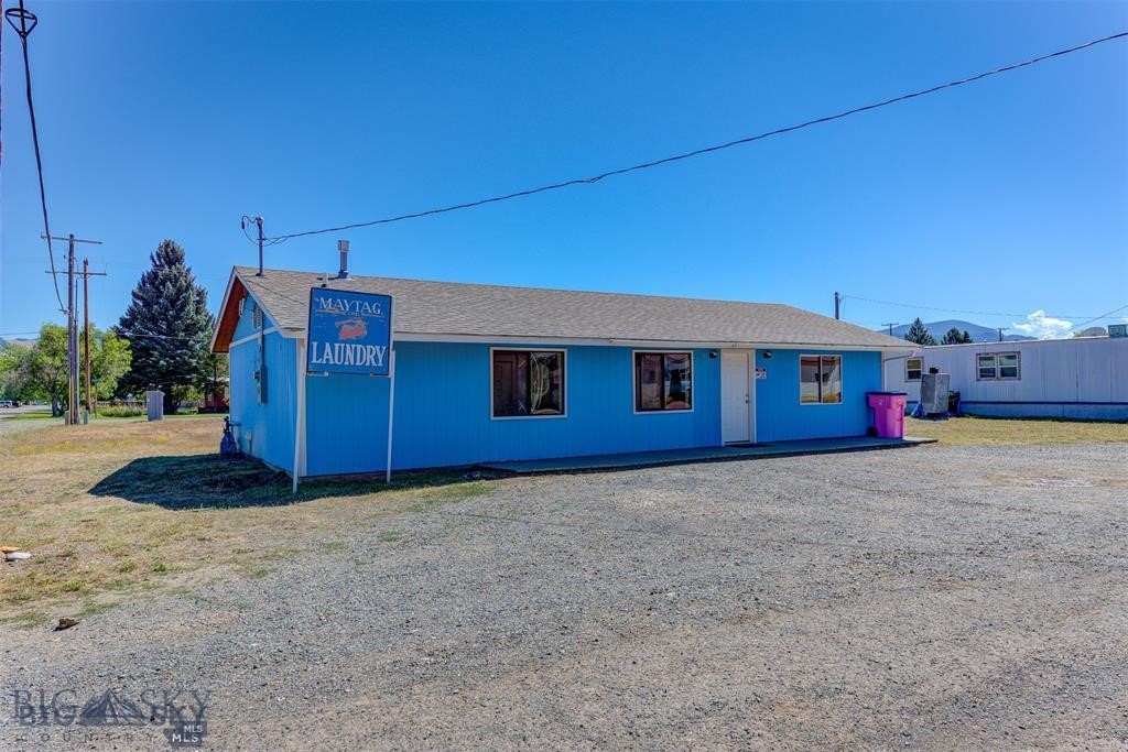 Seize a lucrative investment opportunity with this fully operational, turnkey commercial laundromat. Currently the only laundromat in Boulder MT, this 1,152 sq ft property is perfectly equipped to continue generating consistent revenue. The laundromat comes complete with all necessary equipment, including 12 clothes washers and 12 dryers all coin-operated and commercial washer and dryer for heavy-duty laundry needs. The property is easily accessible with large parking lot. Inside features seating, counters for folding clothes and utility sink for patrons to use. Equipped with security cameras, Coin operated laundry detergent kiosk and change machine. The space includes a small storage room with water heaters, forced air gas furnace and shelving for storage and parts. Small bathroom for customer use. This sale includes everything you need to continue operations seamlessly. From the laundry machines to the operational procedures, step into a business with an established customer base and operational setup.