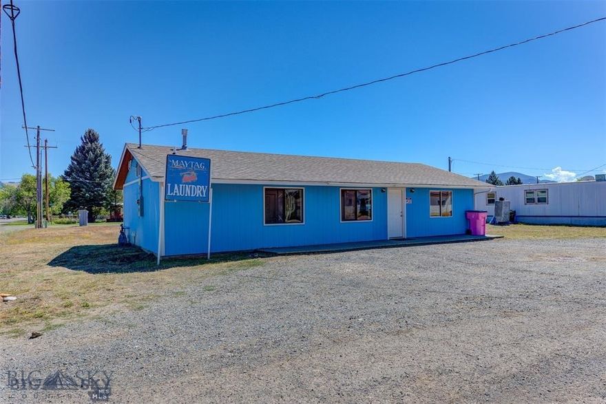 Seize a lucrative investment opportunity with this fully operational, turnkey commercial laundromat. Currently the only laundromat in Boulder MT, this 1,152 sq ft property is perfectly equipped to continue generating consistent revenue. The laundromat comes complete with all necessary equipment, including 12 clothes washers and 12 dryers all coin-operated and commercial washer and dryer for heavy-duty laundry needs. The property is easily accessible with large parking lot. Inside features seating, counters for folding clothes and utility sink for patrons to use. Equipped with security cameras, Coin operated laundry detergent kiosk and change machine. The space includes a small storage room with water heaters, forced air gas furnace and shelving for storage and parts. Small bathroom for customer use. This sale includes everything you need to continue operations seamlessly. From the laundry machines to the operational procedures, step into a business with an established customer base and operational setup.