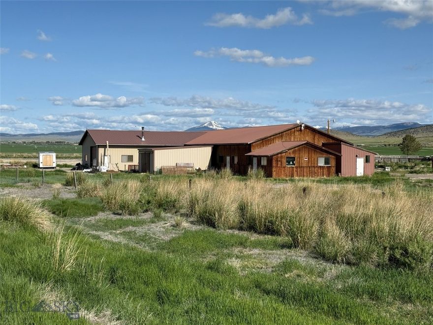 What can you do with 12.6 acres of opportunity near Dillon, MT?  Development potential is very high on this level, easily accessable, and well situated lot.  Zero covenants allow the new owner to further develop the current 7,500 SF of shop space into a small business venture and build a new home in the rear of the property.  Perhaps you're looking for a multi generational piece of land that can put the extensive corral system to use for livestock, and convert the current structure into living quarters for you, your folks, or extended family.  One of the current shop bays has been converted into a an apartment complete with bath and laundry hookups. There is a fantastic biulding side on the far North side of the property, and a new well and septic will be required.  Want a live and work situation?  Storage units?  Absolutely.  Multi family housing or RV park?  You bet, just make sure your design meets current MT DEQ standards. How about a small industrial park offering live/work condos?  The options are vast, but parcels like this located just a few minutes from Dillon, MT don't come around very often.  Call Justin or your real estate professional to view 1548 HWY 278 and make your dreams a reality.