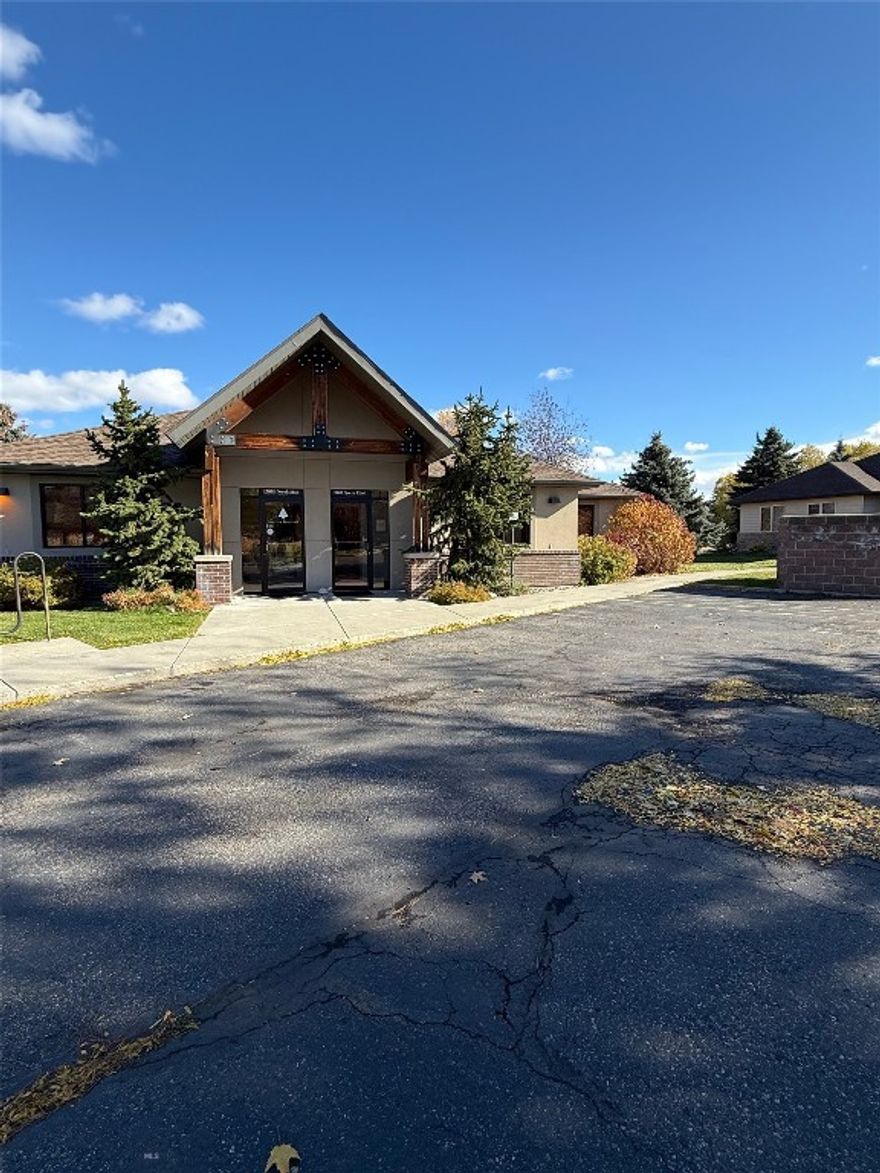 A rare find in a prime location just off N 19th, this centrally located commercial condo offers outstanding accessibility in the heart of Bozeman. Situated in a quiet, professional complex, the attractive 1,908 SF single-level office features front-door parking and easy access.

The well-designed layout includes five large, bright office or treatment rooms with windows, a spacious reception area with front desk, two ADA-accessible bathrooms, a kitchenette, and a large back room with an additional sink and wet bar. There are no shared common areas with neighboring units, offering privacy and a true stand-alone feel.

The space has been meticulously maintained with thoughtful updates throughout, creating a clean, modern, and welcoming atmosphere. Beautiful mature landscaping surrounds the building, with a creek behind the property adding a peaceful backdrop.