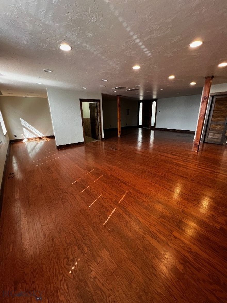 LOCATION, LOCATION, LOCATION! Here it is! An upscale commercial condo with private bath and lots of South facing windows and a ton of CAT 6 connection in the Belgrade Mercantile, probably nicest building in Belgrade, MT. Plenty of free parking across the street, and convenient elevator available. Easy access to the busiest airport in Montana. The Local restaurant and Rhino Bar and Casino are among the other tenants in the building.  Your employees are your most valuable asset.  Why not provide them a workspace they will be proud of? Hurry, it is hard to find such a sought-after space.  Tie up this desirable space while it is still available.