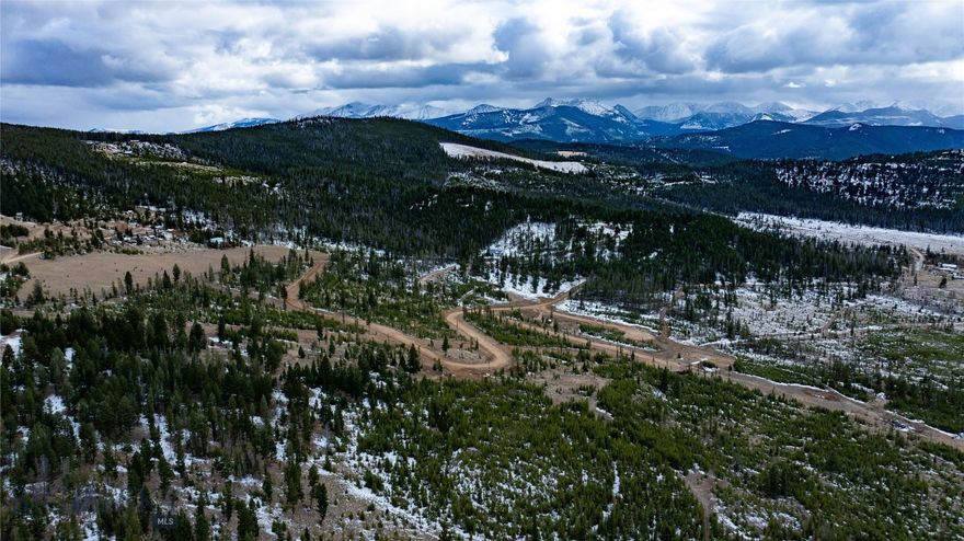 Nestled in the heart of Montana’s picturesque landscape, Betsy Planned Unit Development offers a rare opportunity to own a piece of Big Sky Country. The lot showcases breathtaking views of the majestic Pintlar Mountain Range and provide direct access to a vast network of Forest Service roads and trails, ideal for camping, hiking, fishing, and hunting. Nearby Georgetown Lake sets the stage for year-round recreation. Known for its crystal-clear waters and panoramic scenery, the lake draws outdoor enthusiasts with its exceptional boating, fishing, and hiking opportunities. As winter blankets the area, it transforms into a snowy wonderland perfect for snowmobiling and ice fishing. Discovery Ski Area, only minutes away, offers skiing and snowboarding for all skill levels. Experience the tranquility of the Montana wilderness with the charm and convenience of nearby towns like Anaconda and Philipsburg, where you'll find dining, shopping, and community events throughout the year. Lot 13 offers .53 acres with utilities available and domestic water provided by a shared community water system. Offering flexible building options, it’s an ideal location for a vacation retreat, year-round residence, or short-term rental in one of Montana’s most scenic and recreation-rich regions.