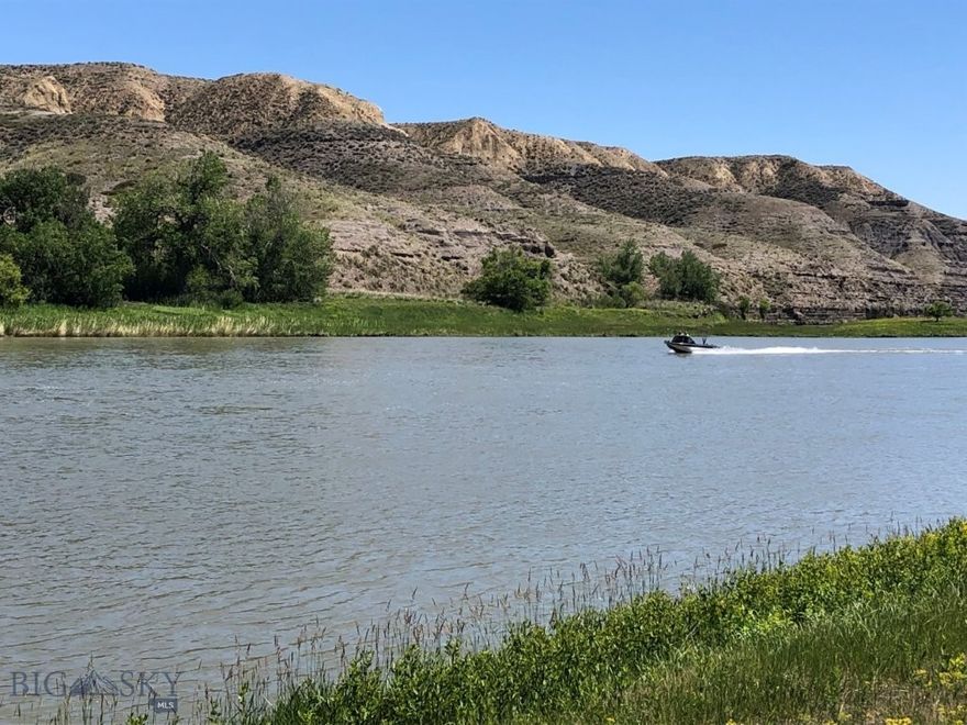 Missouri River frontage with fishing, boating, hunting, and power with BLM land across the river out in the country between Great Falls, Montana, and Fort Benton, Montana. Land in Montana on the banks of the Missouri River isn’t easy to come by. This is your chance to own Missouri River frontage out in the countryside of Montana. It bears repeating that this property has Missouri River frontage. This amazing Montana property borders the Missouri River for 333 feet and gives you approximately 10 acres of land on which you could build your Montana cabin or home. You’ll have the mighty Missouri River right out your front door to see, hear, and go fishing or boating on any time you want. The Missouri River is renowned for its trout, walleye, and pike fishing, as well as smallmouth bass, carp, catfish, and more. By owning river frontage, you’ll have easy access to the river to enjoy day in and day out. Just step out the front door of your cabin with your fishing pole in hand and take to the river for relaxation and fun as you catch the big ones in the waters of the Mighty Mo (Missouri). There are geese, ducks, and other waterfowl, as well as bald and golden eagles, that all use this stretch of the Missouri River for the valuable food and water it provides. The eagles can be seen gliding along the banks of the Missouri River, looking for food, or soaring along the bluffs on the opposite bank, making it seem effortless to look down on everything from above. The deer and antelope in the area also use the river for the valuable water and nourishment it provides. That is evidenced by the trails you can see on the bluffs across the river on the BLM land there. You can watch them from the cabin on your property, and during hunting season, you can hunt that BLM land that borders your land just across the river. In fact, they’ll be within range during the general hunting season as they come down to water at the river. Just wait and watch them from your picture windows. And if that’s not enough, the access road to the property goes through BLM land, where you can hunt and hike, too. There are plenty of other BLM and State lands in the area, as well as block management areas that are open to hunting on private lands. The area is also well known for its fantastic pheasant and upland game bird hunting. You’ll see ring necked pheasants and the other game birds just standing along the roads leading to your property on the Missouri. You can’t go wrong with this one.