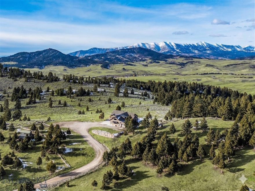 Montana adventures await at this peaceful and private 10-acre mountain enclave, located just 20 min from Bozeman’s historic Main Street. Situated on a ridge against a 219-acre conservation easement, this property features unobstructed of the Bridger Mountains, horse barn and additional outbuildings. The home was built in 2020 and features 5,933 sq ft of well designed space. Enjoy stargazing and ever-changing skies from every window while viewing the abundant wildlife that frequents the property, including elk, moose, deer and more. Subject to light CCRs in a gated HOA with no county zoning, this property offers the freedom to pursue your Montana hobbies. 2-stall horse barn with hay storage, pasture fencing and cross fencing. An additional 2- bay 760+ sq ft shop/toy barn with carport at the entry of the driveway. No view or noise impact from I-90. This home features many upgrades including radiant heating and multiple mini split A/C units. Vaulted living room with stone surround gas fireplace, engineered hardwood floors. Office features western mountain views. The gourmet kitchen features GE Café appliances, granite counters and a dining island. Dining area accesses covered patio with in-slab radiant heat (no shoveling), perfect for indoor-outdoor entertaining. Adjacent mudroom/laundry area with large pantry, a pet wash, and new washer/dryer. The spacious main-level primary suite features a spa-like primary bath with soaking tub, and large, tiled shower. A 2nd guest bed on main has access to a ¾ bath. Upper-level large bonus room with walk-in closets and a tiled bathroom offers flexibility as an additional ensuite guest bedroom. Daylight lower level features walk-out to the covered patio with in-slab heat. Flex recreation room, a guest bedroom, a gym and a ¾ bath on this level. An expansive 1,818 sq ft, 4-bay 5-car attached garage features in floor heat and HRV system. Enjoy the security of a vault lock-off safe/storage room for hobbies/conditioned storage. Property features two 1,000-gallon buried propane tanks, 20-gal min well, a GENERAC backup power system, upgraded windows with custom shades and a Sonos system. Fire mitigation of vegetation and irrigated grounds around the structures. Multiple RV and equipment parking areas. Additional equipment avail for separate purchase. 30 min to MSU, 25 min to Bozeman Health Hospital, 35 min to Bridger Bowl, 25 min to Livingston and blue-ribbon waters of the Yellowstone River. Don’t miss the VR Matterport 360 tour!