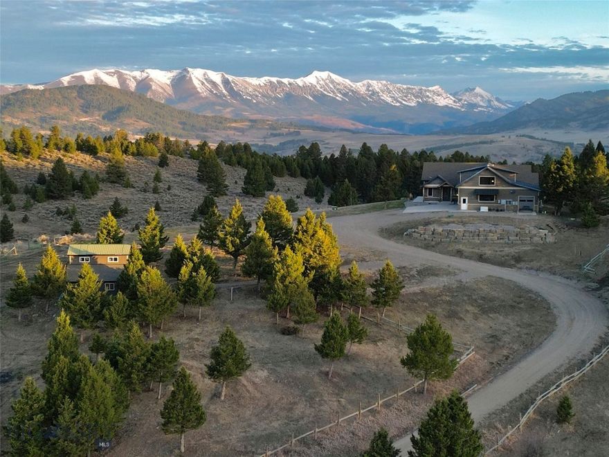 Montana adventures await at this peaceful and private 10-acre mountain enclave, located just 20 min from Bozeman’s historic Main Street. Situated on a ridge against a 219-acre conservation easement, this property features unobstructed of the Bridger Mountains, horse barn and additional outbuildings. The home was built in 2020 and features 5,933 sq ft of well designed space. Enjoy stargazing and ever-changing skies from every window while viewing the abundant wildlife that frequents the property, including elk, moose, deer and more. Subject to light CCRs in a gated HOA with no county zoning, this property offers the freedom to pursue your Montana hobbies. 2-stall horse barn with hay storage, pasture fencing and cross fencing. An additional 2- bay 760+ sq ft shop/toy barn with carport at the entry of the driveway. No view - little impact from I-90. This home features many upgrades including radiant heating and multiple mini split A/C units. Vaulted living room with stone surround gas fireplace, engineered hardwood floors. Office features western mountain views. The gourmet kitchen features GE Café appliances, granite counters and a dining island. Dining area accesses covered patio with in-slab radiant heat (no shoveling), perfect for indoor-outdoor entertaining. Adjacent mudroom/laundry area with large pantry, a pet wash, and new washer/dryer. The spacious main-level primary suite features a spa-like primary bath with soaking tub, and large, tiled shower. A 2nd guest bed on main has access to a ¾ bath. Upper-level large bonus room with walk-in closets and a tiled bathroom offers flexibility as an additional ensuite guest bedroom. Daylight lower level features walk-out to the covered patio with in-slab heat. Flex recreation room, a guest bedroom, a gym and a ¾ bath on this level. An expansive 1,818 sq ft, 4-bay 5-car attached garage features in floor heat and HRV system. Enjoy the security of a vault lock-off safe/storage room for hobbies/conditioned storage. Property features two 1,000-gallon buried propane tanks, 20-gal min well, a GENERAC backup power system, upgraded windows with custom shades and a Sonos system. Fire mitigation of vegetation and irrigated grounds around the structures. Multiple RV and equipment parking areas. Additional equipment avail for separate purchase. 30 min to MSU, 25 min to Bozeman Health Hospital, 35 min to Bridger Bowl, 25 min to Livingston and blue-ribbon waters of the Yellowstone River. Don’t miss the VR Matterport 360 tour!