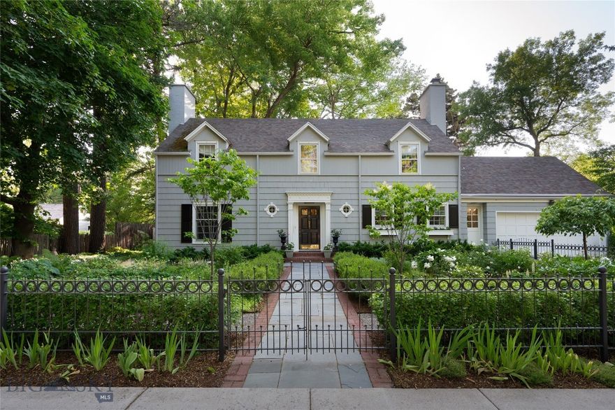 Situated on one of Bozeman’s most iconic & tree-lined avenues, the Scherer House is a shining example of early 20th-century architecture brought to life for modern living. Originally designed by renowned architect Fred F. Willson, this 4-bedroom, 3.5-bath residence has been meticulously restored & thoughtfully renovated—offering a rare blend of architectural pedigree, modern comfort & timeless style. From the exterior's stately gable roof,
dormers, dentil cornice & shuttered windows to the newly added Pennsylvania bluestone walkways, lush perennial gardens & custom iron fencing, every detail reflects care, intention & permanence. A west-facing solarium & grand brick chimney completes the home’s storybook presence. Inside, original dark oak floors pair beautifully with custom crown molding, added art lighting & original architectural elements that have been preserved with reverence. The fully renovated kitchen now features custom cabinetry, high-end appliances, Carrera marble countertops, dual sinks, under-cabinet lighting & a newly built pantry—designed for both functionality & elegance. The main level offers an inviting & warm living room, a refined glass- wrapped formal dining room that brings the outside in, a versatile study/den with custom built-ins & artful recessed lighting. Just off the kitchen, a sunlit flex room offers endless possibility for intimate dining or simply unwinding with a morning coffee. Upstairs offers (4) bedrooms, including a serene primary ensuite with dual closets, and (3) additional bedrooms—each with walk-in closets—served by updated bathrooms. The lower level
was extensively renovated & features a flexible den/office space, a refreshed ¾ bath, new flooring & drywall, laundry & substantial storage. Behind the walls, the home has been comprehensively updated: new heating & central AC, rewired main floor with recessed & art lighting, attic insulation, new hot water heater, and replaced windows on the main floor. Outside, the grounds have been transformed with mature trees, hundreds of
perennials & shrubs, a pergola, custom iron & privacy fencing, irrigation systems & professionally designed landscaping. An oversized one-car garage adds easy convenience for parking & storage, and the property’s alley-loaded access offers an opportunity to build an additional garage if desired. All just blocks to downtown Bozeman, this is more than a home. It's a generational residence where historic character meets bespoke
modern living.