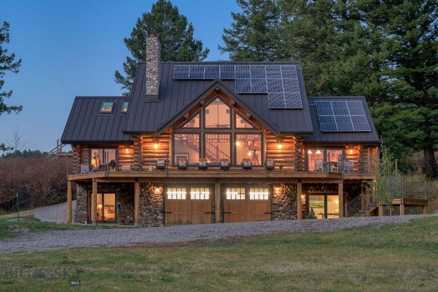 Nestled in the heart of Bridger Canyon, 20 minutes to downtown Bozeman, this Montana mountain log home offers a blend of privacy, craftsmanship, and natural beauty. This 4,498 square foot residence sits on 20.21 acres of Montana wilderness. Over 1000 feet of Bridger Creek meanders over the property - fish for trout outside your front door! Sunlight floods the great room - the heart of the home - is complete with floor-to-ceiling windows, a vaulted ceiling, and a striking fieldstone wood-burning fireplace. The main suite has a wood-burning fireplace, an en-suite bath, walk-in closet, and access to a quiet deck area. The lofted second floor has two bedrooms, a Jack and Jill bath, and an office leading to a pretty Juliet balcony. The walk-out daylight basement has 2 bedrooms, a full bath, family room, and office. Thoughtful updates preserve the authentic character of a mountain log home, adding handcrafted details like the custom-milled red and white oak floors—harvested from the owner’s family farm in South Carolina—and New Zealand wool carpeting. The kitchen has been upgraded with Viking and Wolf appliances, leathered granite counters, and a farmhouse sink. Three baths were remodeled adding walk-in glass showers, heated floors, towel warmers, and custom cabinetry. Cedar shingles were replaced with a metal roof, the original deck was rebuilt with new decking, stairs, and railing. Windows, including the large picture wall in the great room, have been replaced to enhance energy efficiency and capitalize on the views. Installing modern infrastructure like 2 new septic systems, solar panels, Generac generator, heat pump, central air, and a new furnace add peace of mind. A bridge crosses the creek to a private trail system for hiking, skiing, or peaceful exploration. A 48' x 36', 2-Story Barndominium, adds value with a main-level shop featuring closed-loop glycol in-floor heat. The unfinished upper level boasts vaulted ceilings, wall of windows, and a 1,300 square foot wraparound deck with breathtaking views. A new separate septic system is in place for future customization of this bonus space. Observe as elk, bear, moose, and other wildlife stop by the creek for a drink. Sipping coffee on the sunny, south-facing deck or setting off on a fly-fishing, skiing, or hiking adventure, this property invites you to slow down and reconnect with nature. Offering rare seclusion with proximity to world-class recreation, this is Montana living at its finest.