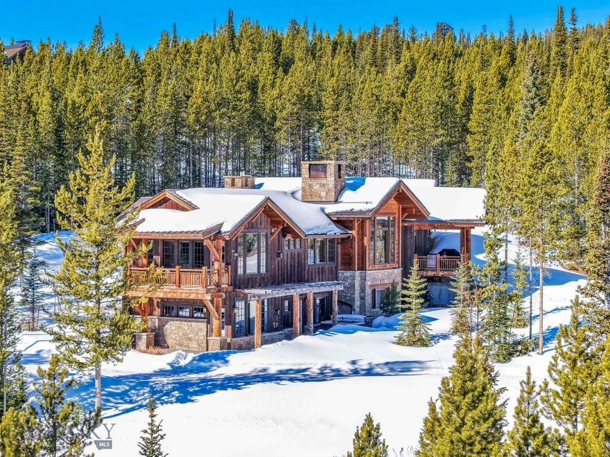 Located on 1.07 acres in the desirable Elkridge neighborhood of Spanish Peaks Mountain Club, 755 Eagle View Trail offers a beautifully crafted mountain retreat with approximately 4,624± square feet of living space and spectacular views of the Spanish Peaks, including the stunning Wilson Peak. Built in 2014, this thoughtfully designed ski-in/ski-out home blends timeless mountain architecture with comfortable modern living.

The main level features an inviting open-concept living space with kitchen, dining, and family room, centered around a striking rock fireplace and framed by a large picture window that captures breathtaking alpine views. Rich woodwork and exceptional craftsmanship are showcased throughout the home. This level also includes one bedroom, a full bath, powder room, laundry area, and direct garage access.

The lower level provides generous accommodations with three additional bedrooms, three bathrooms, and a spacious family room. After a day outdoors, relax in the private hot tub located just off the lower level and enjoy the peaceful mountain setting.

Ideally positioned for easy ski access, this home offers a perfect base for year-round mountain adventures.

Ownership includes the opportunity to join the Spanish Peaks Mountain Club, one of the region’s premier private clubs, with the option of either Golf or Social Membership. Members enjoy an exceptional array of amenities including a Tom Weiskopf-designed championship golf course, ski access to Big Sky Resort, clubhouse dining, fitness facilities, and year-round outdoor recreation. The community continues to evolve with the highly anticipated Aspire building scheduled for completion this summer, which will further elevate the club experience with new luxury amenities and gathering spaces.

Combining spectacular views, thoughtful design, and access to world-class amenities, this Elkridge residence offers an exceptional opportunity to experience the best of mountain living.

Contact your favorite, local Big Sky real estate professional to arrange a private tour today.