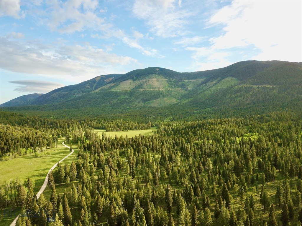 For the serious hunter or outdoor enthusiast, this 401.9-acre stretch of raw Montana wilderness offers the ultimate escape. Located just seven miles west of the timber town of Lincoln, this private mountain property lies in a prime wildlife corridor near the Continental Divide—renowned for its trophy game and unmatched backcountry access.
Whether you're chasing the bugle of a rutting bull elk in September or tracking deer through the timber come rifle season, this land delivers. Elk, whitetail and mule deer, black bear, mountain lion, and other species are known to roam this area heavily. Game trails crisscross the property, and the terrain varies from rolling meadows to dense timber—ideal habitat and great visibility for glassing or setting up blinds.
A gravel road traverses the property, offering easy access for trucks, side-by-sides, or snowmobiles, so you can hunt or scout without limits. No covenants or HOAs are restricting your use, giving you the freedom to build a hunting cabin, park a camper, or establish a base camp for year-round recreation.
In the off-season, ride your ATV, snowmobile, or horse through the forested trails, or forage for huckleberries and mushrooms. Fishing and floating opportunities await just across Highway 200 on the legendary Blackfoot River.
The land comes with water rights for stock water and sits between Missoula and Great Falls—both with international airports—making travel and resupply easy.
If you're looking for a rugged, untamed slice of Montana where the wild still rules and the adventure never ends, this is it.