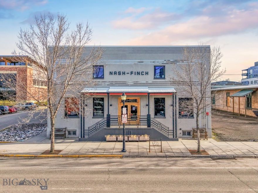 The iconic Nash-Finch Building presents a significant commercial opportunity in the heart of historic downtown Bozeman. Originally constructed in 1915 by renowned Bozeman architect Fred Willson, the Nash-Finch Building has long been a cornerstone of downtown commerce, dating back to Bozeman’s early days as a trade center and outpost. Much of the original character remains—brick walls, original oak floors, and a grand entryway preserve the historic charm of the structure.  Fully restored in 2011 and further renovated over the past five years for high-end retail and office use, the building is in exceptional condition. Currently configured with one retail suite and three office suites, tenants benefit from everything downtown Bozeman has to offer: Main Street exposure, private off-street parking, full ADA accessibility, and walkability to all things downtown. With close proximity to Montana Ale Works, the Bozeman Public Library, and numerous parks and businesses, the location offers rare visibility and synergy within the community. The Nash-Finch Building stands as one of Bozeman’s finest historic commercial properties currently available—a unique opportunity for the investor or business who values location, quality, and timeless architectural character.