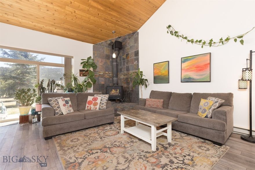 Ideally located in the heart of Big Sky’s Town Center, this beautifully appointed 3-bedroom, 3-bath condominium offers approximately 1859± square feet of comfortable mountain living. The residence features new flooring throughout, stainless steel kitchen appliances, and a striking wood-burning stone fireplace with a handsome slate backdrop that anchors the main living space. Large windows frame beautiful mountain views while mature trees create a private, serene setting off the patio. Perfectly positioned for enjoying all that Big Sky has to offer, the property is just minutes from cross-country and downhill skiing, parks, trails, and the public golf course, while Town Center’s vibrant dining, shopping, and year-round events are just a short distance away. The world-renowned Gallatin River is also nearby, offering exceptional fly fishing and recreation.