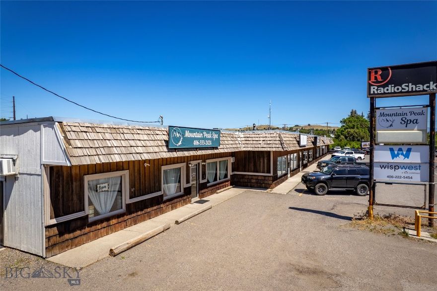 Prime investor opportunity! Fully leased commercial mini mall zoned Highway Commercial in the heart of Livingston.  Strategically located on West Park Street, Livingston's primary corridor, offering excellent visibility and high traffic counts.  Park Street's turning lane provides easy access from either traffic direction making this a very sought after location attractive to commercial tenants.  Plus it has terrific parking making it even more ideal!  This property accommodates a broad range of commercial ventures including retail shops, spas, medical offices, restaurant, and other service-oriented businesses.  Excellent tenant occupancy with long term occupants and units are metered separately for gas & electric. Building is 7537sf situated on railroad leased land, lease is $9530/yr.  Perfect for for savvy investors seeking a stable income stream.  Livingston's economy is strong, this area is thriving and is supported by a community that values local businesses which enhances business retention.