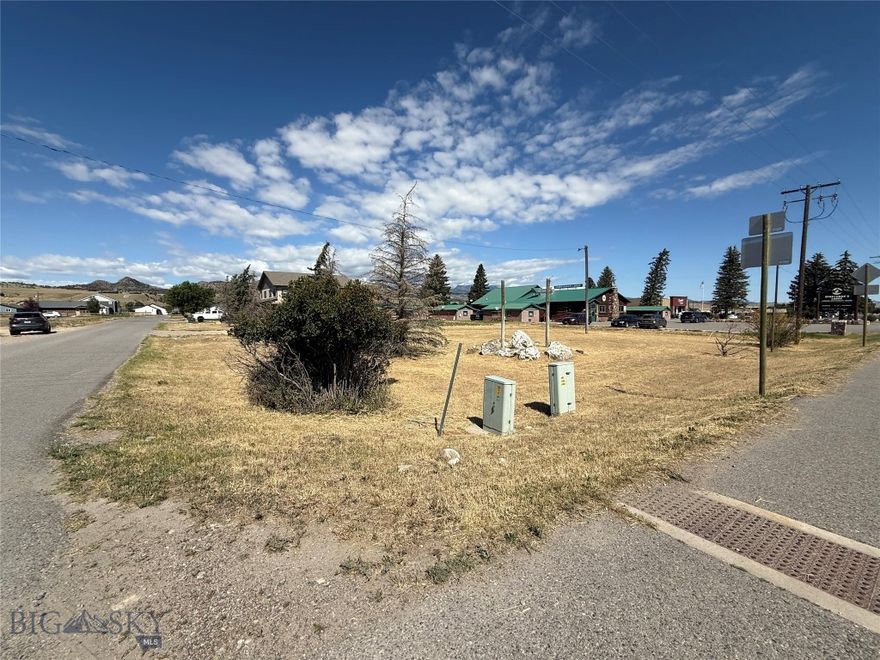Large lot adjacent to the Sportsman's Lodge on US Highway 287, just north of downtown Ennis, at the corner of Clark St. It is across the highway from the Madison Valley Medical Center and across Clark Street from the Red Bear Inn. This lot is zoned "Highway commercial" with a Conditional Use Permit allowing commercial or multi-family units.  The lot has city water and sewer available, excellent traffic exposure and good side-street access.  The adjoining Lot 2A (1,150 SF) to the west, is also available.