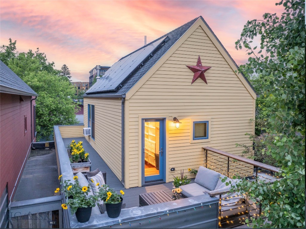 Prime location, downtown lifestyle, and solar-powered efficiency—all in one incredible townhome. Just off Main Street in downtown Bozeman and near Beall Park, this modern retreat offers the perfect blend of urban convenience and peaceful privacy. 
Inside, you'll find soaring tall ceilings, polished concrete floors, and a gas stove that create a warm, contemporary vibe. The chef’s kitchen features updated countertops, stainless steel appliances, a whole-house water softener, and reverse osmosis filtration at the sink—ideal for healthy, sustainable living.
A flexible bonus room on the main level makes a perfect office, and the updated powder room adds everyday convenience. The living room opens to a fully upgraded redwood-slatted patio, a true private oasis for entertaining or relaxing.
Upstairs, enjoy a vaulted master suite with cherry wood floors, walk-in closet, and a spa-style bath with double vanity, oversized tile shower, and anti-fog LED mirror. Step outside to your second private patio with downtown views, perfect for a morning coffee or evening unwind.
The daylight basement features two large bedrooms, a full bath, laundry with cabinetry, and an additional living area. You’ll also find an unfinished utility room for future expansion or extra storage.
This home is solar powered and equipped with a new boiler and three-zone radiant floor heating, delivering year-round comfort and energy savings. The private one-car garage includes built-in shelving. Outside, enjoy low-maintenance landscaping with drip irrigation and seasonal blooms.
Live sustainably. Live beautifully. Live in the heart of Bozeman.