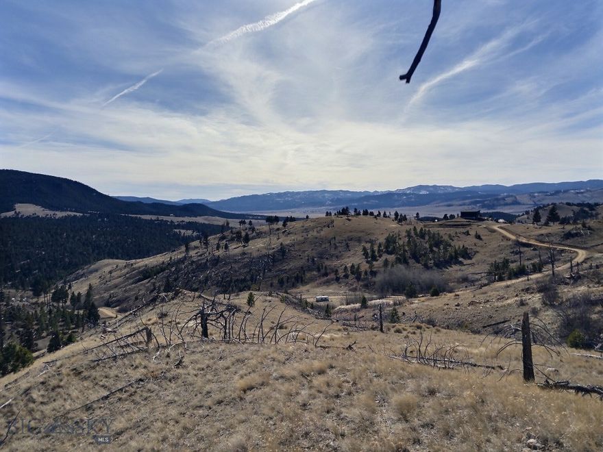 Twenty acres in the ELK HORN Mountains with panoramic views and a sunny southern exposure. Borders a State owned 640 acre section on the entire North property line AND literally thousands of acres of Forest Service land on the entire East property line. Lots of BLM land is close too.  Productive 15+ gpm well and 1000 gallon septic system are already installed.  Power is close the property and lot is perfect for Solar. Easy 10 minute access to amenities in Boulder.  Breathtaking views, trees, rock outcroppings and wildlife signs everywhere.  Don't miss this one of a kind opportunity!