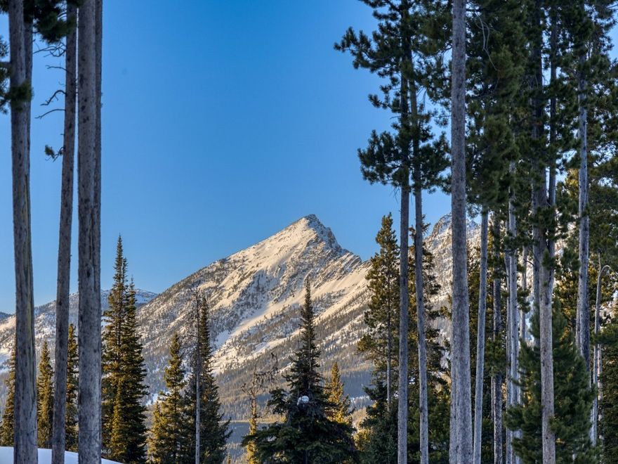 Homesite 168A on Speaking Eagle Road is the largest available vacant homesite in Big Sky's Cascade Subdivision, sprawling over 4 acres of wooded freedom. The views are vast enough that it feels as though the landscape is limitless.... as if *anything* is possible here. Pending HOA approval, you can build a home and guest home (in that order). You can either short or long term rent either or both of the homes... or keep it all to yourself. You can walk to the other end of the street (only a few hundred yards) to pop onto a groomed ski trail that connects to Big Sky Resort. So it's nearly ski accessible, but it does require a bit of walking. If you're a snowbird seeking respite from the impending summer heat, the cool mountain evenings will certainly scratch that itch. The air up here is clean, crisp, and scented with fir, spruce, and possibility. There is a geotechnical report available. 

There isn't a requirement to build, this is Montana afterall. You can own this parcel until you decide to build the home you've imagined. Perhaps lots of glass and outdoor spaces to capture the expansive views afforded at this elevation? Maybe an artists studio, writer's loft, the most badass work-from-home space. When in doubt, buy and hold land, they're not making more of it. Not like this, anyway!