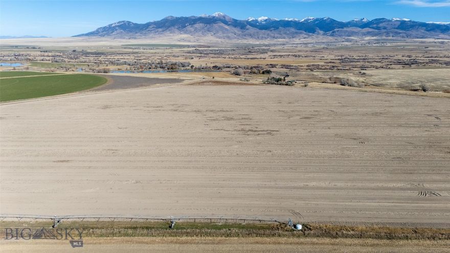 Over 88 acres in pristine SW Montana farmland country complete with pivot and water allotment from East Bench canal. The past 6 years have had a grain and potato rotation so the soil is rich and ready to go. Fall work is done and the ground is ready for your drill to hit it in the spring. Plenty of acreage in the corners of this land to build a dream home. This parcel is also offered as part of MLS 406766 which includes home, shop and addition acreage. Call for details!