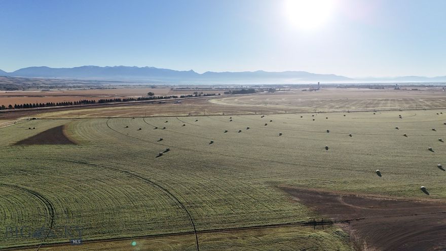 NO COVENANTS OR ZONING! Irrigation water rights, pivot and wheel line all convey. Property currently planted in alfalfa, leased by tenant farmer. Creative Seller - Bring your ideas!! 84+ beautiful acres of farm land just minutes outside of Manhattan. 360 degree views of the mountains and surrounding hillsides. Incredible opportunity for business and commercial use as well with I-90 frontage, and access to exits just a few minutes away. Great mountain views in all directions. *Disclosure: Listing Agent related to Seller.*