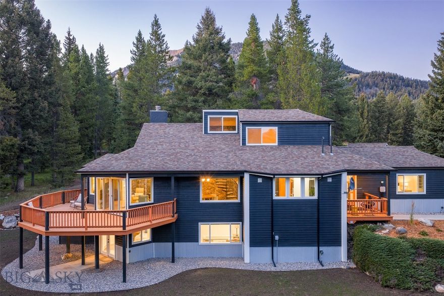 Come see this unique property on 10 acres, with Lone Mountain Ranch ski trails right next door!   Located between the Meadow and Mountain Village areas of Big Sky, this three-level home offers five bedrooms, five bathrooms, an entertaining kitchen, and an expansive deck, all in a tranquil, mature tree setting. There are glimpses of the original construction, with timber and rock accents, combined with a flourish of modern updates from a recent remodel.  The spacious upper-level room could easily serve as an office, art studio or bonus room. This amazing property is being sold furnished as seen and has the Nordic ski and hiking trail system of the Lone Mountain Ranch adjacent to the property and the resident elk herd is often bedded and grazing onsite. Skiing at the Big Sky Resort is ten minutes away as is fishing and whitewater rafting on the Gallatin River, and the Town Center with all Big Sky area amenities is just down the road, for summer concerts, farmers’ market, movie theatre, restaurants and shopping.