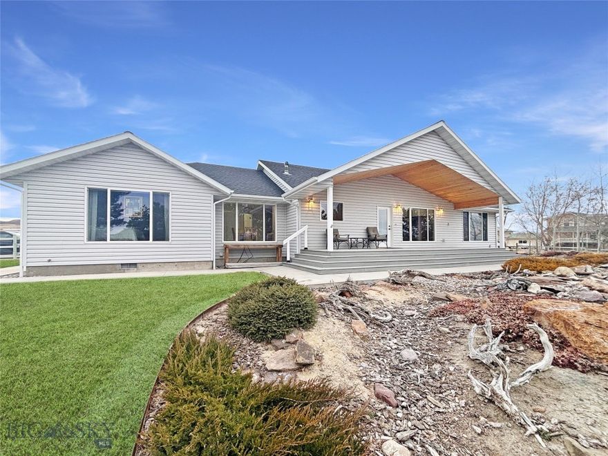 Timeless, classy, and thoughtfully designed, this custom-built 2003 home offers the comfort, space, and peaceful setting Montana living is all about. Hardwood floors, quartz countertops, and an open kitchen, dining, and living area create a warm, welcoming heart of the home. Oversized picture windows fill every space with natural light and showcase the mature landscaping and beautiful waterfall just outside. A cozy stove and built-in speaker system throughout the main level, front porch, and back patio make it easy to relax or entertain year-round.
The bright primary suite feels like a private retreat with a spacious bath and oversized walk-in closet, while two guest bedrooms and a full bathroom on the opposite side of the home provide comfort and privacy for family or visitors. Downstairs, the fully finished basement adds incredible flexibility with a full bath and three large bonus rooms ready for an office, gym, theater, hobbies, storage, etc!
Step outside to enjoy underground sprinklers, irrigated and cross-fenced pasture (equipped with hand-line), peaceful views, and the soothing sound of the waterfall. An oversized attached 2-car garage plus a 30x45 shop with power, lights, and overhead doors offer plenty of space for projects, trailers, and all your Montana toys, along with a convenient concrete wash pad equipped with a drain!
Move-in ready and designed for both everyday living and gathering with the people you love — this is a property you truly need to experience in person. Call me today for a private showing!