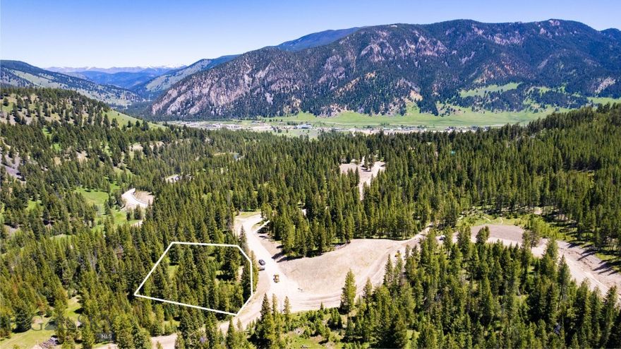 Gallatin Foothills Lot 32 features north-northwest views and a private build site, offering easy access to the trail system. Its location within Phase 2 provides a peaceful environment with stunning mountain vistas.  Gallatin Foothills provides residents with spacious lots ranging from 1 to 2 acres, complemented by over 75 acres of dedicated open space. Each homesite, complete with mature trees and privacy, has been meticulously selected and designed to capture breathtaking sunrise and sunset views, alpenglow, and expansive mountain vistas, all while remaining conveniently close to town amenities. Neighborhood amenities include world-class Terra Flow mountain biking trails, sledding hills, and parks with open spaces perfect for hiking and cross-country skiing. At the base of the development, a trail network provides access to public lands, ideal for snowmobiling, ATV riding, and mountain biking. Fishing enthusiasts will appreciate the incredibly convenient 5-minute access to the Gallatin River.
A short drive brings you to Big Sky’s Town Center, Big Sky Resort, and an even shorter trip to Ophir Elementary School, Lone Peak High School, the Warren Miller Performing Arts Center, and countless trailheads and recreational opportunities.
