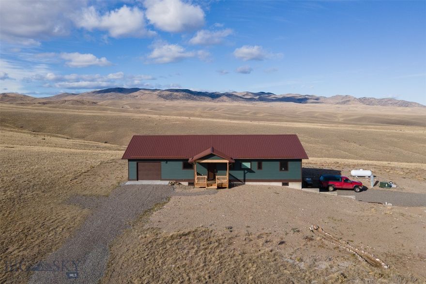 Lovely new home on 20 partially fenced acres, built in 2023 with two garages and 1776 SF of finished square footage with partial finished basement.  Features include 1536 SF on the main level with 3 bedrooms and 2 baths and another 1536 SF basement. Basement is partially finished with a  laundry room with laminate flooring and large office with fiber optics for those working from home. Basement has heat, a large workshop area for the handyman and single garage which keeps your vehicle toasty. There is also another single attached garage on the main level. When you enter the home you are greeted with lovely tongue and groove wood interior in the living room with porcelain tile throughout,  The kitchen has stainless appliances,  quartz countertops, large dining room with lots of natural light and pantry. Primary bedroom/bath has a 1 piece acrylic tub/shower with roof, lighted closets, and guest bath has a walk-in tiled shower.  Bedrooms are all good sized with lighted closets and built in shelving so dressers are not taking up your living space. Efficient on demand water heater, central heat with AC, constant pressure well pump, insulated poured foundation, Anderson Fibrex casement windows, Diamond Kote siding and metal roof. The 20 acres affords both privacy and room for your critters, partially fenced and ready for your personal touch. Located only 2 miles from the Big Hole River and lots of BLM land in the area to ride from your house.