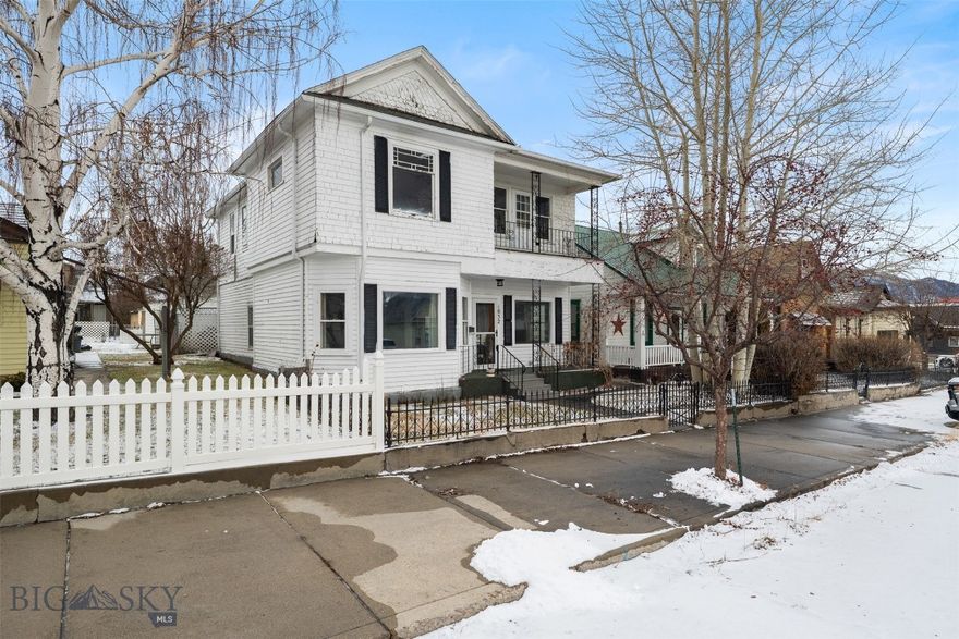 Charming historic home with flexible living options and duplex potential. The main level offers a comfortable one-bedroom, one-bathroom layout with a kitchen, living room, and spacious laundry room—perfect for single-level living. The upper level functions as a private secondary living space, featuring its own bedroom, bathroom, kitchen, and living room. It can be accessed by a private exterior entrance or through a recently installed spiral staircase from the main level, offering versatility for owner-occupants, guests, or rental opportunities. Enjoy views of the iconic Lady of the Rockies and surrounding mountain ranges, adding to the home’s charm. A private, fenced backyard with patio creates a peaceful outdoor retreat. There is also a single-level garage accessed from the alley. Full of character and classic appeal, this thoughtfully arranged home presents a rare opportunity for multi-generational living, income potential, or a unique single-family residence.