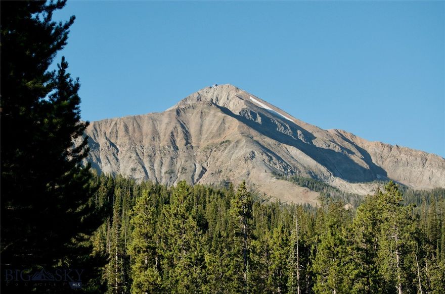 If you want to walk out your door and get on a ski lift while still being on a quiet cul de sac this 1 acre Moonlight Basin lot is it. Still close to all the
amenities of Moonlight Basin with majestic views of Lone Mountain, Fan Peak and the Spanish Peak mountain range. Open space in front of the
lot with a beautiful meadow with stream that invites wildlife to come visit. Jayhawk lift outside your door and services this small
neighborhood. Like your own personal street ski lift. Geotech report available for lot. Moonlight Basin membership required and at the
responsibility/cost of the buyer. Enjoy one of the world's best ski resorts and one of the finest clubs while having multiple trout streams and
Yellowstone National Park close by. Moonlight Basin golf course, Lakeside Lodge and Madison Village are right down the street. Overlook 2 is
private, close to amenities and is like having your own personal ski lift. Come see it! 

Architectural plans are approved by Moonlight Basin review board so you are ready to roll on building your dream Montana home! Rendition pictures show a very modern stylish ski home. Buyer to verify all information to their satisfaction.