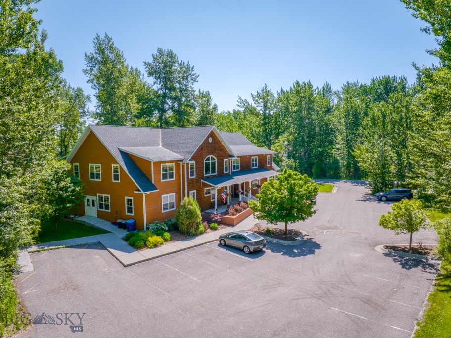 This ±10,104 SF two-story office building sits on ±0.84 acres in the quiet Galactic Park Subdivision of Four Corners, just west of Bozeman. Built in 2006, the property includes 21 private offices, four open work areas, a conference room, break room, recording studio, green room, and five restrooms, along with mechanical and storage rooms. An elevator and two stairwells provide second-floor access. The flexible layout accommodates single or multi-tenant use, with a welcoming reception area at the main entrance. Located in a low-traffic setting near the Gallatin River and surrounded by high-end homes, the property offers a tranquil alternative to more commercial corridors. Nearby employers include Zoot Enterprises, Mesa Labs, and Wildfire Defense Systems. Serviced by Four Corners Water & Sewer and equipped with a fire suppression system, the building is in good condition with no known deferred maintenance. A well-designed, adaptable office building in one of the most scenic areas of the greater Bozeman area.