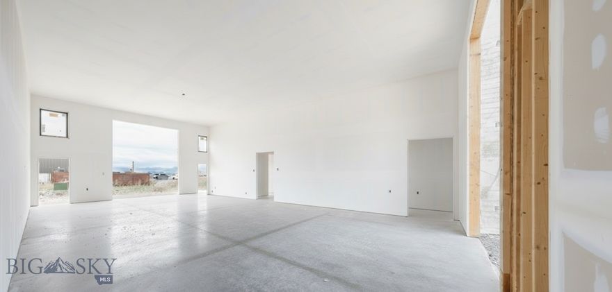 Fremont Square Condominiums is a new Live Work Condo complex off Jackrabbit and E Valley Center. The Fremont Flex Plan is built for versatility—where workspace and living space come together in one smart design. The main level offers over 1,300 square feet of open commercial space with 15-foot ceilings and 14-foot overhead doors on both ends, creating a true pull-through garage perfect for light industrial use, toy or car collection storage, or a small business operation. Durable finishes and a clean, open layout make it easy to customize for your needs. A private entrance leads upstairs to a modern two-bedroom, two-bath residence with an open kitchen, bright living area, and contemporary finishes throughout. This area is easily converted to office space desired. Each unit includes upstairs balcony, expansive views, and thoughtful design that balances function and Montana style. Located within Fremont Square—Bozeman’s newest live/work community along Jackrabbit Lane—the Fremont Flex offers prime visibility, quick access to I-90 and Big Sky, and the freedom to live and work on your own terms.