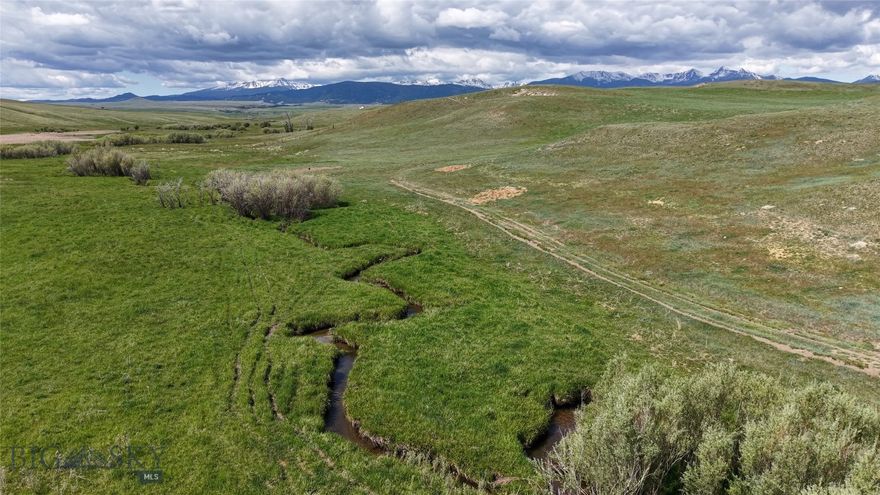 Norwegian Creek 480 is part of the historic 126+ year-old Maichel Ranch, located just outside of Harrison, Montana. Set beneath the Tobacco Root Mountains and just upstream from Harrison Lake, this 480-acre property offers 1/2 mile of creek bottom privacy, open space with huge views, and strong potential for an equestrian estate, small ranch, or private retreat.

The land consists of three 160-acre legal parcels with multiple building sites ranging from private, wooded creek areas to open hilltops—all offering sweeping 360-degree views. The property borders a 640-acre section of State land with another mile-plus of Norwegian Creek frontage, further expanding recreational access and ensuring an extremely private setting with no other homes in view.

Over 200 acres of the property can be farmed or cropped separately for food plots, grain production, or other agricultural uses. Elk, deer, upland birds, and other wildlife are frequently seen on the land, enhancing its appeal for hunting and outdoor enjoyment.

Located at the end of the road on the historic Maichel Ranch, the property provides excellent privacy with convenient access—just 45 minutes to Bozeman and 20 minutes to Ennis. Nearby power and road improvement materials can be made available by the seller with an acceptable contract, offering additional development flexibility. Seller offers to lease property for grazing purposes to create cash flow for new owner.

Generations of careful stewardship are reflected in Norwegian Creek 480’s productive capacity and natural beauty, making it a rare opportunity in southwest Montana.