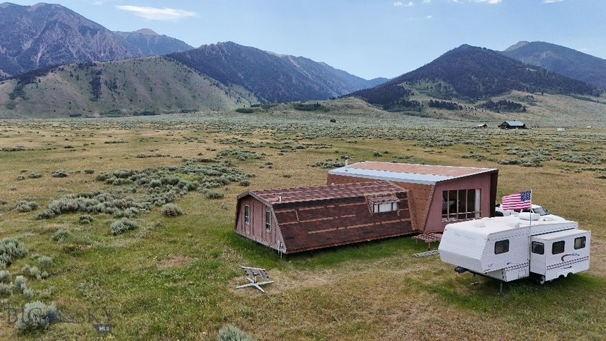 Outdoor enthusiast’s dream in Cameron, MT – welcome to Sportsman’s Paradise!!! This 20-acre parcel offers unbeatable access to world-class recreation. Located just off Hwy 87 and only 5 minutes from the legendary Madison River (Raynolds Pass and Three Dollar Bridge), it’s also just 15 minutes to Cliff and Wade Lakes, 15 minutes to Quake Lake, and 20 minutes to Hebgen Lake. Walk to thousands of acres of National Forest for hiking, hunting, and snowmobiling. West Yellowstone and Yellowstone National Park’s entrance are only 30 minutes away.
A bonus feature is the 1,800 sq ft recreational cabin/home, lived in seasonally by the current owner. While livable, the cabin is unfinished (see photos). The home is off-grid and powered by solar; power and fiber-optic are nearby for future connection.  HURRY this will not last long!!!