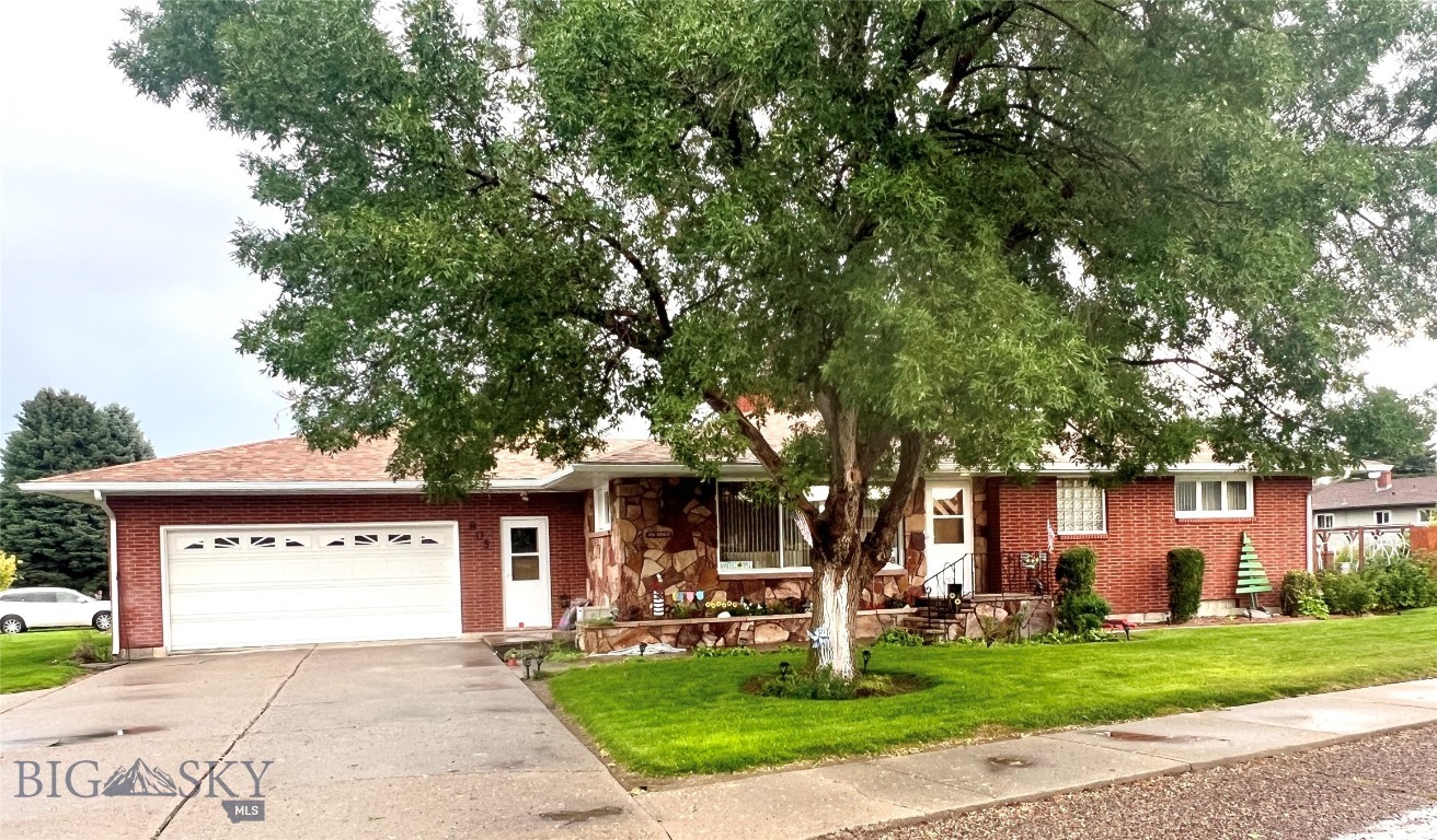 Take a look at this charming 2,882 sq ft brick home in a great neighborhood! The perfect fit for those who are looking for a cozy and warm place to call home. As you drive up you will notice the beautifully landscaped yard with mature trees and shrubs and drive through driveway. You will enter the home going up beautiful stone steps and into a welcoming living room with large windows letting in lots of natural light. Main floor features two bedrooms, one full bath, kitchen with dual wall ovens, cook top, dishwasher and plenty of cupboard space, dining area with patio door to back yard, and a half bath off garage. The basement features a wide staircase down to the family room with gas fireplace, one bedroom, bonus room/den, large laundry room with additional storage room. This lovely home also has a large 2 car garage with plenty of room for all your outdoor toys,. Grab a cup of coffee and take a seat on the patio in the back yard and take in the beautiful landscaping. Call today for your own private showing. Make this your new home.