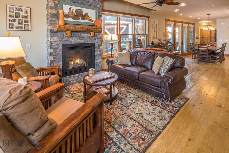 This Essentia condo offers a smart, comfortable layout paired with one of the most convenient locations in Big Sky. With three bedrooms, 2.5 baths, and a two-car garage, it’s an easy fit for full-time living, a vacation home, or a place to land for weekends in the mountains.

The main level features an open living area with a gas fireplace, a functional kitchen and dining space, and good natural flow throughout. A dedicated mudroom makes everyday life practical, especially during ski season. Upstairs, a second gas fireplace creates a warm, inviting space to unwind in the second living area. The bedrooms are split between two levels with the primary suite on the second floor and two bedrooms and a full bathroom on the top floor. The guest bedrooms have the advantage of Yellow and Lone Mountain views.

Outside, a private, covered patio extends the living space and is already wired for an outdoor hot tub for relaxing after a day on the trails or slopes.

The location really sets this property apart. Just about a quarter mile from Big Sky Town Center, you’re close to restaurants, shops, weekly farmers’ markets, free summer outdoor concerts, and dog-friendly cross-country ski and hiking trails. The skier shuttle to Big Sky Resort is nearby, making mountain access simple year-round.

A well-laid-out condo in a walkable, central location, this Essentia home offers convenience and the best of Big Sky living.

Please note: the property photos show furnishings, but the condo is being sold mostly unfurnished.