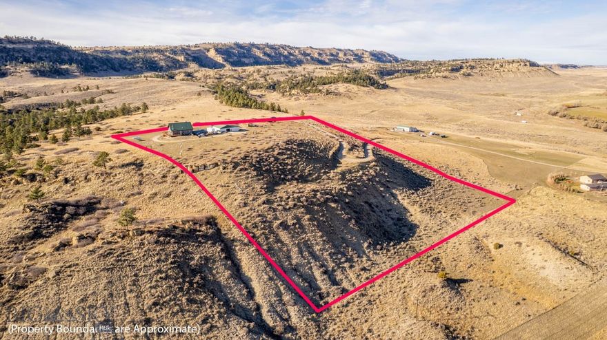 Rustic warmth meets modern comfort in a setting surrounded by quiet beauty with abundant wildlife and expansive views of the nearby mountains. This move in ready 4 bed/3 bath log home sits on 10 acres with a 50x30 shop. The open main living area features cozy touches and plenty of room to gather by the fire, while the kitchen features solid wood cabinetry, durable countertops, and modern appliances. The primary suite is a peaceful haven with a generous layout, private bathroom, and an exclusive balcony. Additional bedrooms throughout provide comfortable space for guests, family, or home office. The lower level of the home features a large living space, bedroom, and bathroom with direct access to the attached 3 car garage. Tucked away yet close enough to town, this property offers the perfect balance of privacy, convenience, and mountain living. BRING THE HORSES! No covenants or HOA.