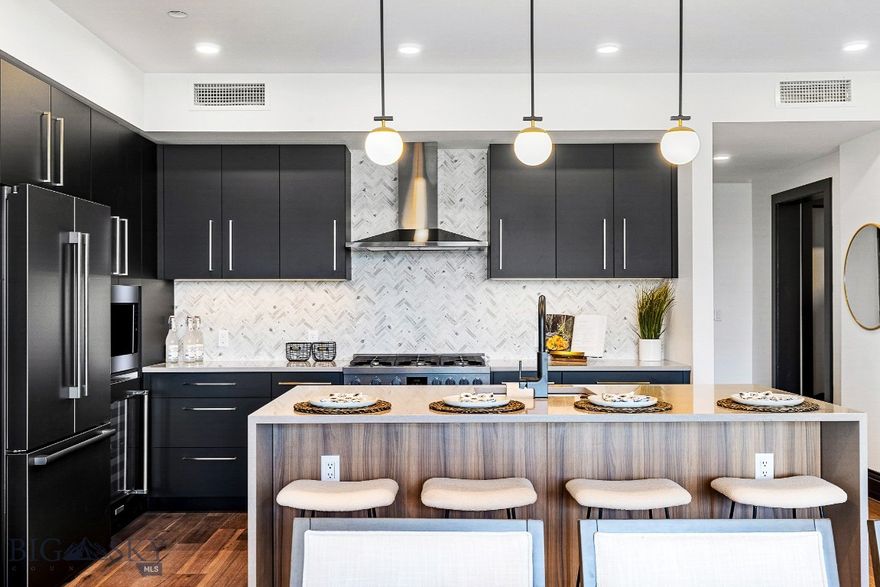 Light and bright, this North facing unit in The Henry, a six-story luxury condominium building in Downtown Bozeman, #403 has a bright and airy feel to it. Sitting on over 1,635 SF with two bedrooms, plus den, two and a half bathrooms, and a 120+- sf heated balcony, this unit has it all. With engineered oak hardwood floors, wool carpeting, quartz countertops and Bosch appliances to go with high-end fixtures and tons of natural light, this condo is a ready-made luxury offering in the heart of the Rocky Mountains’ coolest town. And it doesn’t stop there - The Henry building has amenities that make it more than just a residence: a ground floor fitness center, a private, landscaped courtyard and climate-controlled, secure underground parking. Just three blocks from Main Street, twenty-five minutes to Bridger Bowl and forty-five minutes to Big Sky Resort, you'll have easy access to the vibrant downtown scene, outdoor recreational activities, and Montana's stunning natural landscapes.