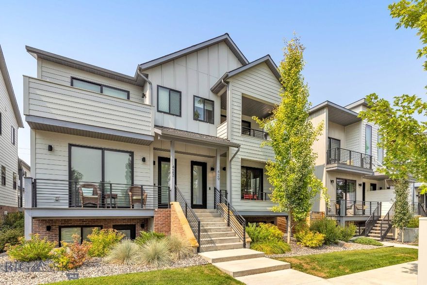 Contemporary living with an ADU, just blocks from downtown Bozeman! This spacious townhome offers a thoughtful layout with an open kitchen, living, and dining area on the main level, filled with natural light and inviting outdoor spaces. Upstairs, the generous owner’s suite includes a covered porch to enjoy the morning sun, a spa-like bathroom, and a versatile office or sitting area. The lower level features two bedrooms, each with en-suite bathrooms and private patios, along with a laundry room and additional storage. A rare two-car garage anchors the property, topped by a one-bedroom ADU apartment with its own large deck — ideal for guests, rental income, or multi-generational living. Located on North Willson, just four blocks from Bozeman’s vibrant and historic Main Street, you’ll have restaurants, shops, galleries, and nightlife at your fingertips. Beyond downtown, Bozeman offers an unmatched lifestyle: quick access to the Bridger Mountains for skiing, biking, and hiking, nearby trails and rivers for year-round outdoor recreation, Montana State University’s cultural and educational opportunities, and a welcoming community known for its balance of small-town charm and big-city amenities. This property blends modern comfort, investment potential, and the best of Bozeman living.