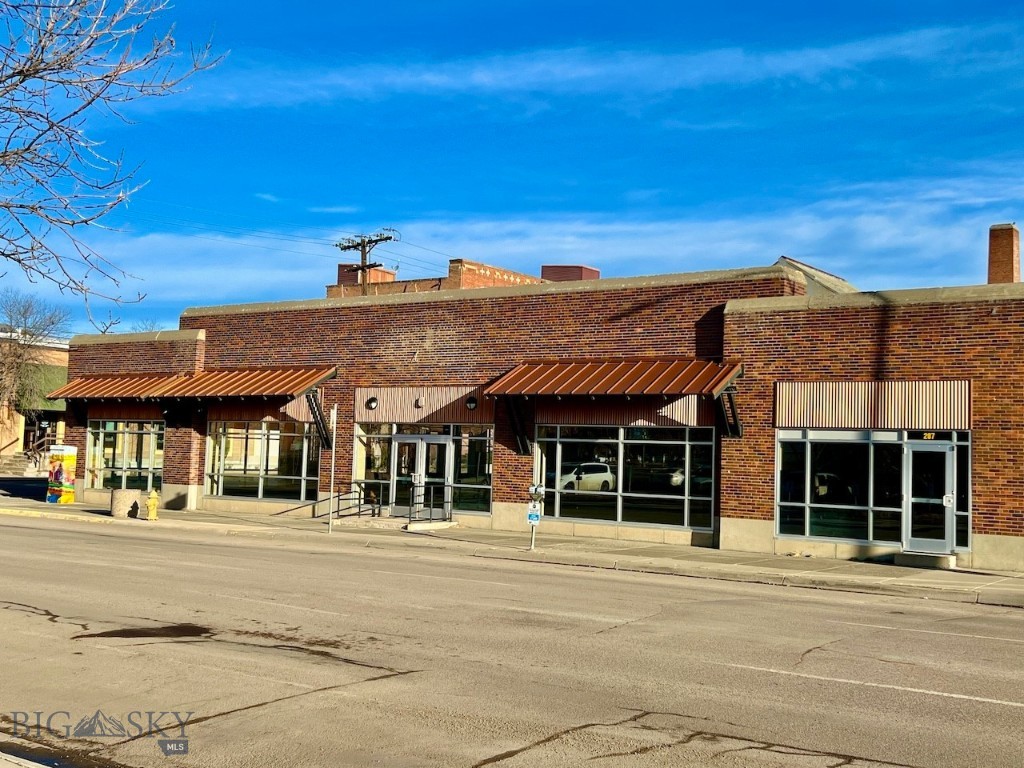 Located in the heart of downtown Great Falls, Montana, this commercial building and warehouse is situated on the corner of 2nd St. S. and 2nd Ave. South assuring exceptional visibility and attention. The high-traffic location is just inside the Downtown Parking District, so it benefits from the parking advantages. The commercial building is just under 15,000 square feet, with approximately 8,000 sq. ft. of it encompassing the showroom. The large windows supply tons of natural light and allow visibility to the street. In addition, the building has high ceilings, multiple entrances, a floorplan that includes 5 separate offices, 4 bathrooms, a break/conference room, front counter space, an IT room, a copier/office supply room, several storage rooms, and a heated warehouse with an overhead door and street access. The warehouse can serve as private parking as well. Significant upgrades were completed in 2008 including new plumbing, electrical, roof, HVAC, and windows to this 1914 historic downtown gem. From 2008-2022, the building served as a furniture, appliance, and electronics store. A segment of the property (207) could be utilized as a separate business with its own entrance, bathroom, office space, kitchenette, and storage. The building at 215 2nd Ave. So. Provides 26,000 additional square feet of space to store or accommodate a buyer’s business possibilities. Collect income and lease the space out. As Great Falls grows and the downtown area adds incentive, these buildings are in prime locales to utilize as you see fit.