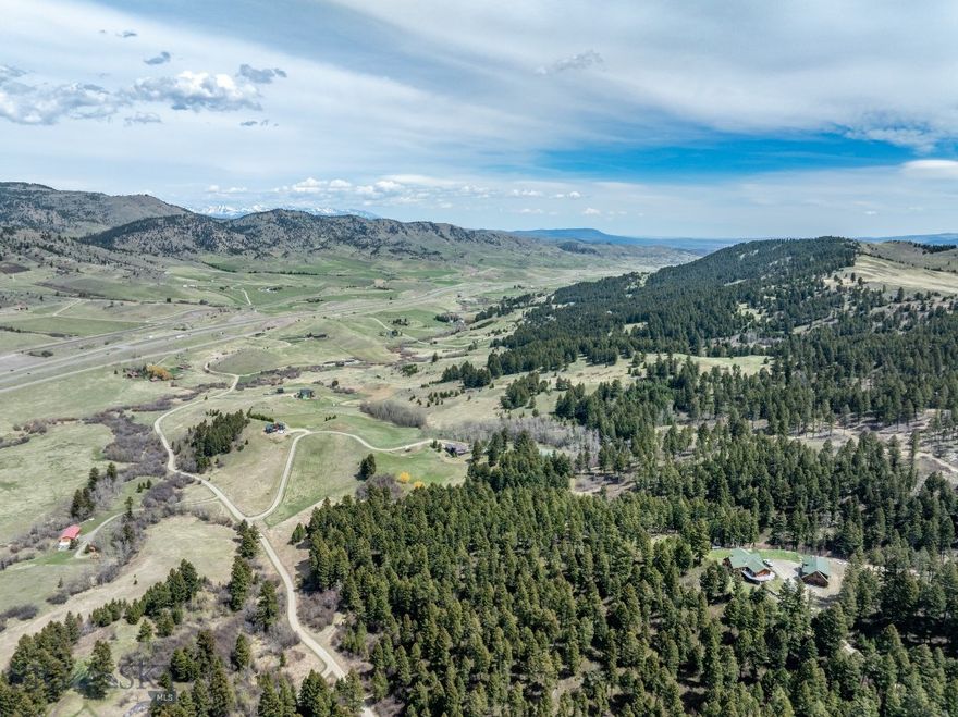 End of the road privacy on this 15+/- acre private parcel located between Bozeman and Livingston. With quick access to Bozeman (17+/- miles West) and Livingston (13+/- miles East) this is truly an ideal location. The property is located midway up a this north facing mountain, with a year round spring creek, mature timber and a great mountain access road. The animals and birds are frequent residents of the area and can be seen on most days throughout the year. The mountain road into the parcel offers a lower and upper building area. The upper building location would require additional road/dirt work. The parcel does have light covenants but no formal HOA. The road easement (off of Elk Ridge road) is shared by several other land owners and currently there are no other homes built along the private drive. If you are looking for mountain acreage close to town with an end of the road feel then you need to see this. There is a resident herd of elk, whitetail deer, black bear, moose, and upland birds that also call this land home.