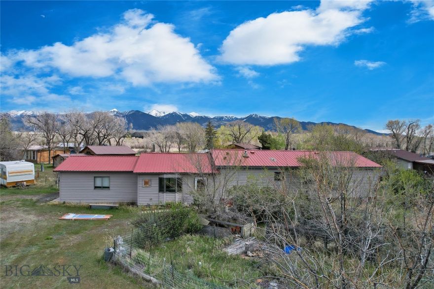 RIVER ACCESS is only 0.2 miles down the road from the property. This is a well kept home just minutes from Twin Bridges or Whitehall. Home has wood heat as well as a brand new propane furnace for the main part of the house. The addition has a woodstove as well as a free standing rinnai style heater. Addition has a nice sliding glass door with a view of the mountains, closet and access to the garage. Inside the main home is 3 BR, 2 BA, large living room with an open floor plan, dining area as well as a nice sized eating bar. The door goes out on a small deck giving you easy access to the complete screened in porch area. Enjoy your morning coffee watching the sun rise over the Tobacco Root Mountains or an evening enjoying the stars from the screened in porch and not have to worry about the bugs pestering you! The home has an attached garage as well as a detached garage with an attached workshop area. The detached garage has a bathroom as well as a washer hook up. Hunting, hiking, horseback riding, or using the backroads to explore the mountains in your side by side, you will find a multitude of recreational opportunities. Call today for more information regarding this great property.