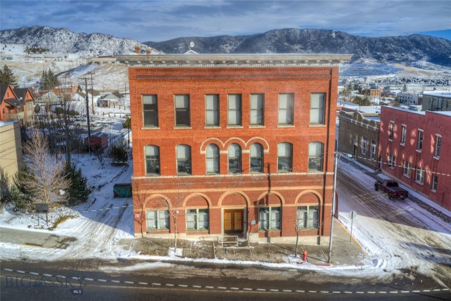 Originally constructed in 1892, the Tuttle Building has endured and added to the rich history of the Mining City over the last 132 years and is ready for its next chapter of history to be written. With 3 levels and over 17,000 SF above ground, along with a full basement, there is an abundance of space for a new end use. With designated C3 Mixed Use Zoning, opportunity awaits with a variety of potential uses - including residential condos or apartments, boutique lodging, dining, retail, office space, and medical professional space. Extraordinary original details remain throughout the building including oak woodwork, tin ceilings, and 3 historic vault doors to reincorporate into your rehabilitation design. 

Located within the Urban Revitalization Agency and Opportunity Zone boundaries - there may be potential financial incentives, grant funding, and tax credit opportunities for the rehabilitation of this historic structure. The Tuttle is centrally located with the ever popular Original Mine Yard to the NorthWest, Federal Court House to the North, Butte Silver Bow Archives to the West, and Uptown Business District to the South. Unique to Butte, this structure offers unobstructed exposure on all four sides with wonderful views in all directions. 

Although there will be some infrastructure upgrades necessary, the building has many amenities that will be beneficial to a new owner including: a membrane roof, upgrades to wiring, newer sewer line to the street, wooden double pane replacement windows, commercial kitchen, a modern fire escape at the rear of the building, and elevator service infrastructure to all floors. Current courtyard space to the East could be converted to private off-street parking. The paved lot adjacent to that area is owned by Butte-Silver Bow and is not included in the sale of this property.