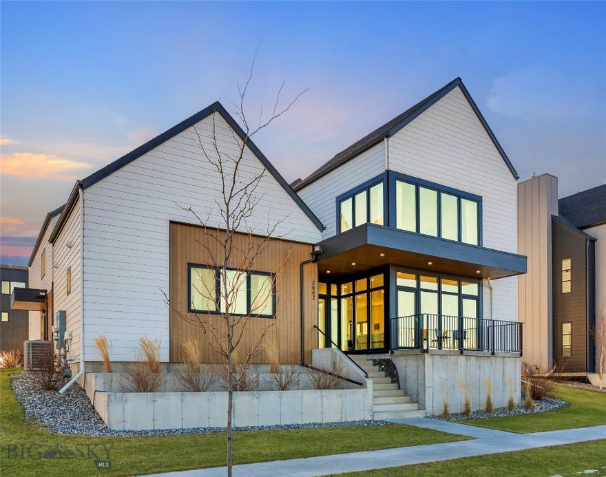A rare opportunity in Gran Cielo, this striking modern home combines thoughtful design, flexible living, and iconic Bridger Mountain views. Floor-to-ceiling glass frames a direct view of the “M” while overlooking 4+ acres of park space—offering a sense of openness that’s hard to find in Bozeman. The layout is both functional and versatile, featuring 4 bedrooms, 3.5 baths, two primary suites, and a spacious main-level bonus room ideal for an office, gym, or second living area. The upstairs primary suite is a true retreat with vaulted ceilings, a generous walk-in closet, and a full wall of windows capturing Montana’s natural light. An attached 847± sq ft ADU with private entrance adds exceptional value and flexibility—perfect for rental income, extended guests, or multigenerational living. The ADU includes its own kitchen, laundry, and full set of appliances. Located in one of Bozeman’s most sought-after communities with easy access to MSU, trails, downtown, and everyday amenities, this home offers a unique combination of lifestyle, design, and long-term value. Homes with this level of flexibility, views, and location are limited—schedule your showing today.