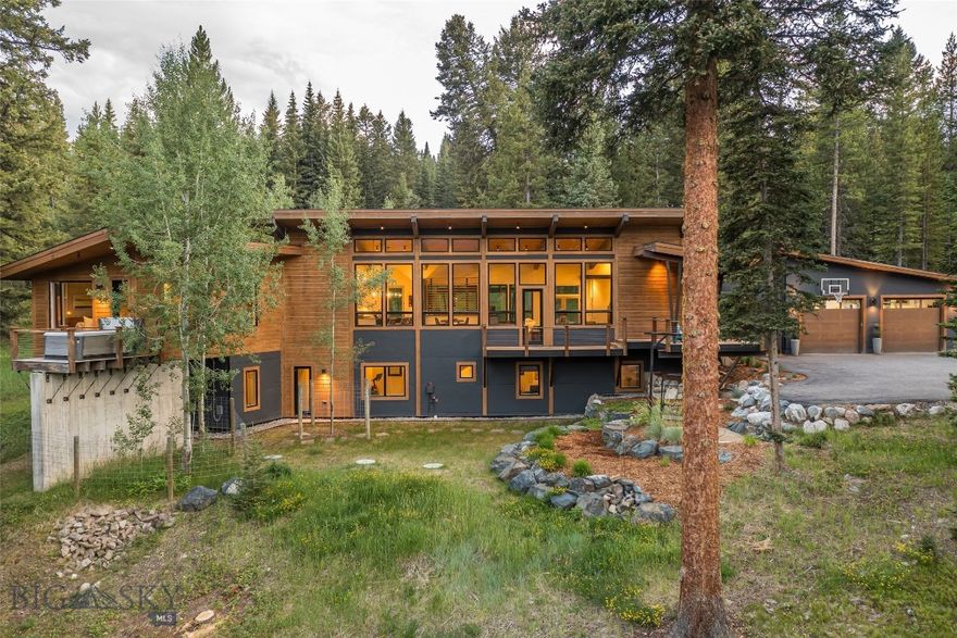 Tucked into 4.35 acres of pristine forest in the exclusive Ruf Minor Subdivision, and backed up to Spanish Peaks North Open Space, this elegant 4-bedroom, 4.5-bath mountain estate offers the ultimate in privacy, sophistication, and year-round Big Sky living. Spanning over 3,000 square feet of finely crafted interior space, the home balances timeless rustic elements—vaulted wood-beamed ceilings, wide-plank flooring, wood burning fireplace, outdoor covered patio, outdoor woodburning firepit, and huge views of the Spanish Peaks.

A true chef’s kitchen anchors the open-concept main living space, outfitted with high-end appliances, custom cabinetry, and a generous island for effortless entertaining. Walls of windows frame sweeping views of Montana’s alpine wilderness, Spanish Peaks, allowing the interiors of natural light and connecting you to the surrounding landscape.

The main-level primary suite is a serene retreat with a spa-inspired ensuite bath, while the lower level offers three additional bedrooms, three full baths, and a spacious lounge area—ideal for guests or extended stays. A heated oversized 2 car garage plus an additional detached shop provides ample storage for vehicles, gear, and recreational equipment.

For the nordic ski enthusiasts, the magic is right at your doorstep: step outside to direct access at the end of your driveway to Lone Mountain Ranch’s groomed cross-country trails, along with seamless access to Big Sky’s Resorts world-class downhill skiing, golf, hiking, and fly fishing—while returning home to your private forest sanctuary. A short drive to Big Sky's Town Center, and a 10-minute drive to The Biggest Skiing in America. 

This home will not last long, please call listing agent to schedule a showing.